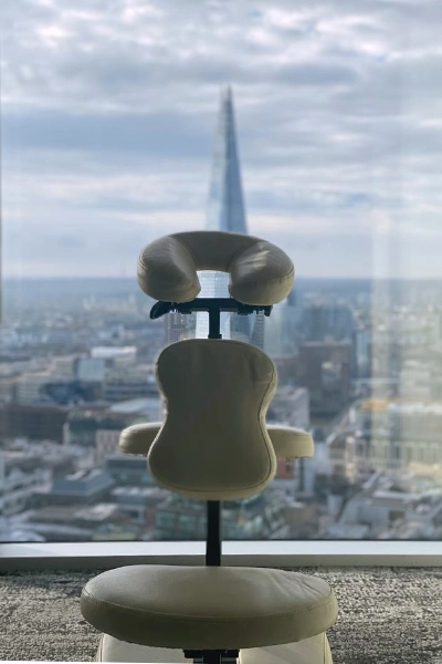 Mobile Massage Events setup with massage chair and City of London backdrop for corporate wellness
